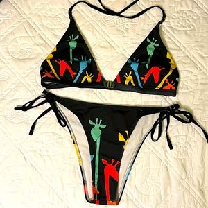Colorful giraffe print side tie bikini with buckle front.